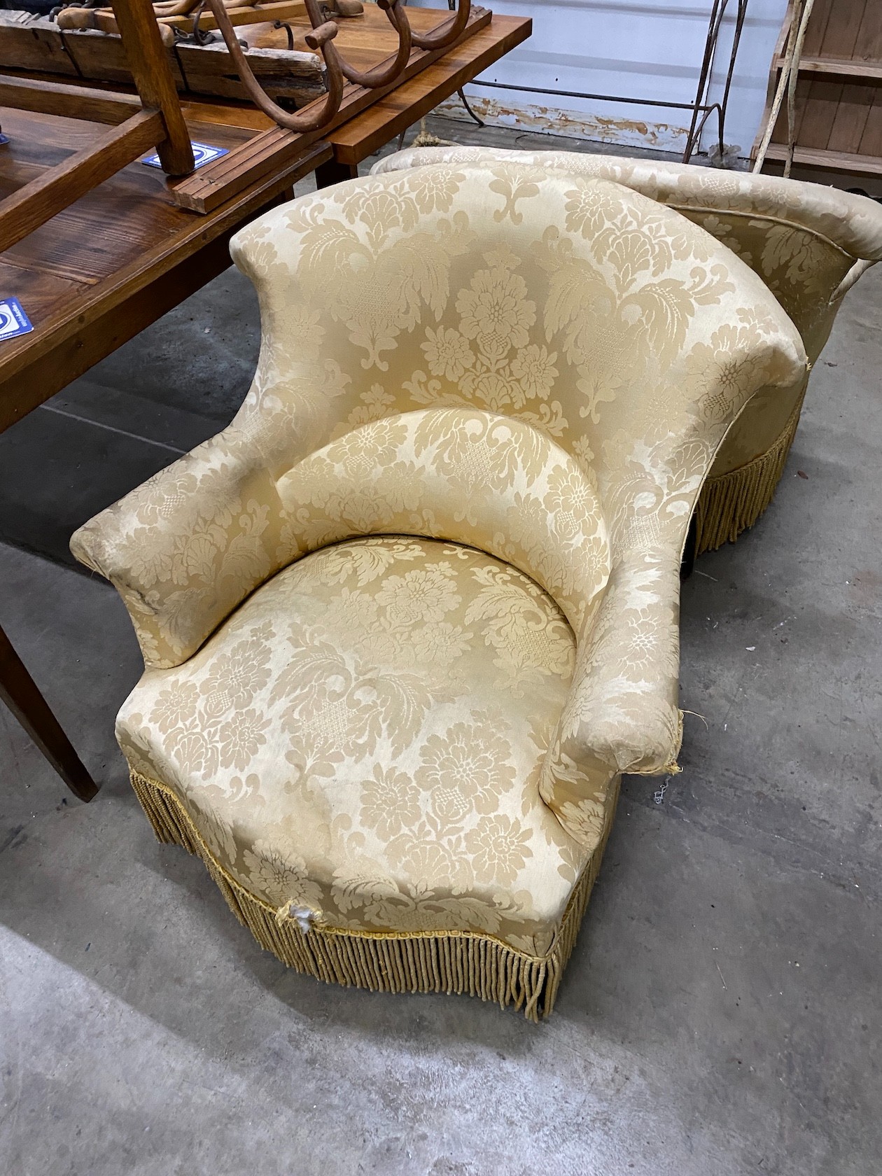 A pair of late Victorian upholstered tub framed armchairs
